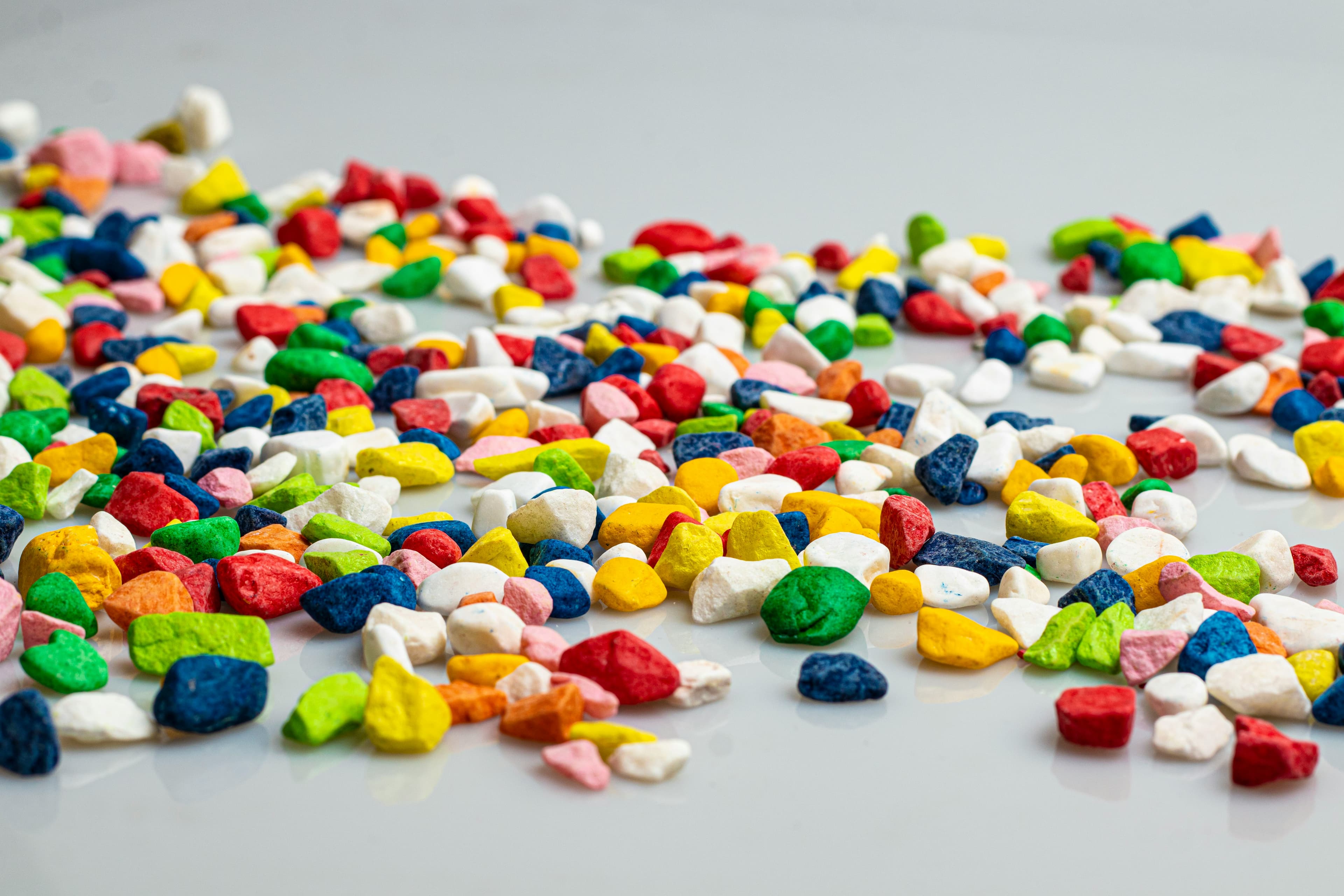 Colourful recycled plastic regrind flakes — mixed ABS plastic ready for processing